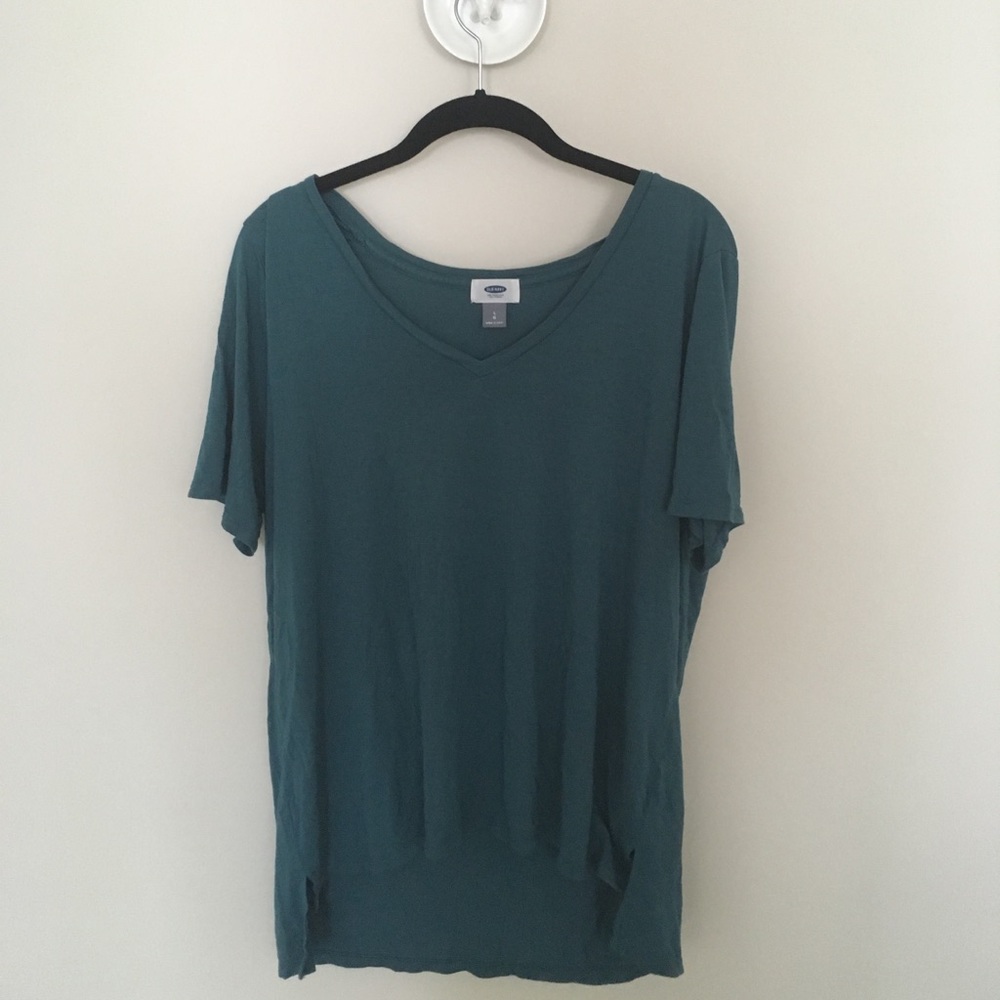 Teal/turquoise shirt.